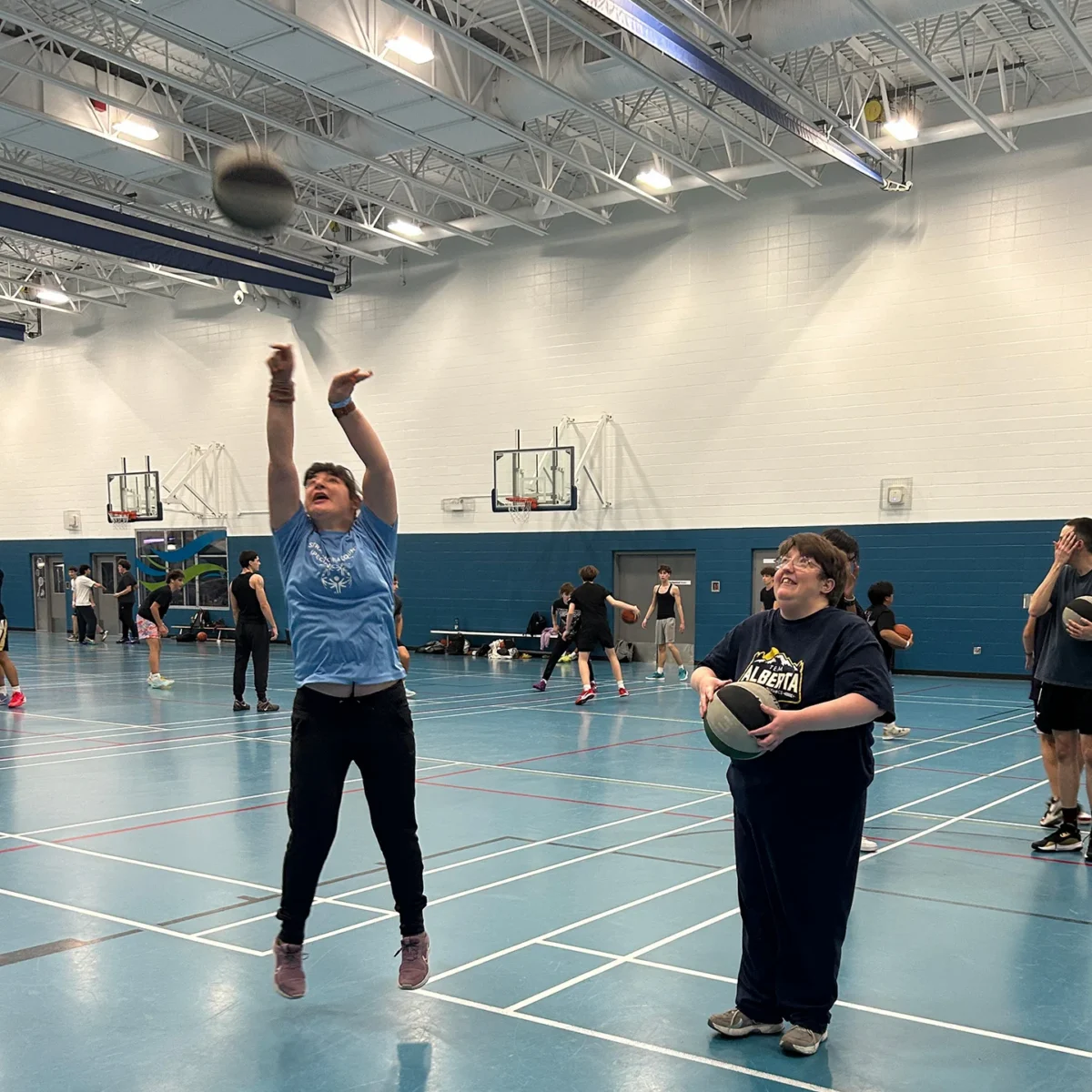 Two Athletes Playing Basketball - Branchability - Adapted Recreation Programs