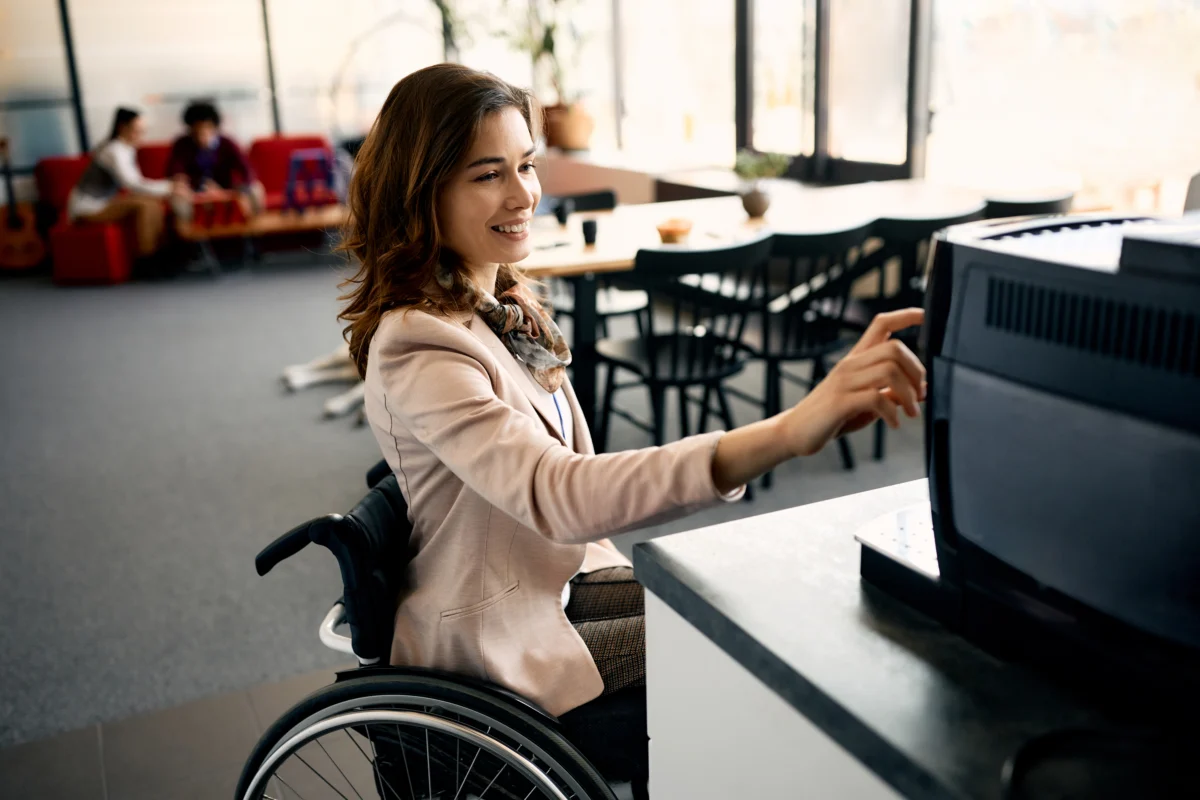 Woman in Wheelchair working in accessible office thanks to Branchability Inclusive Workshop and Training