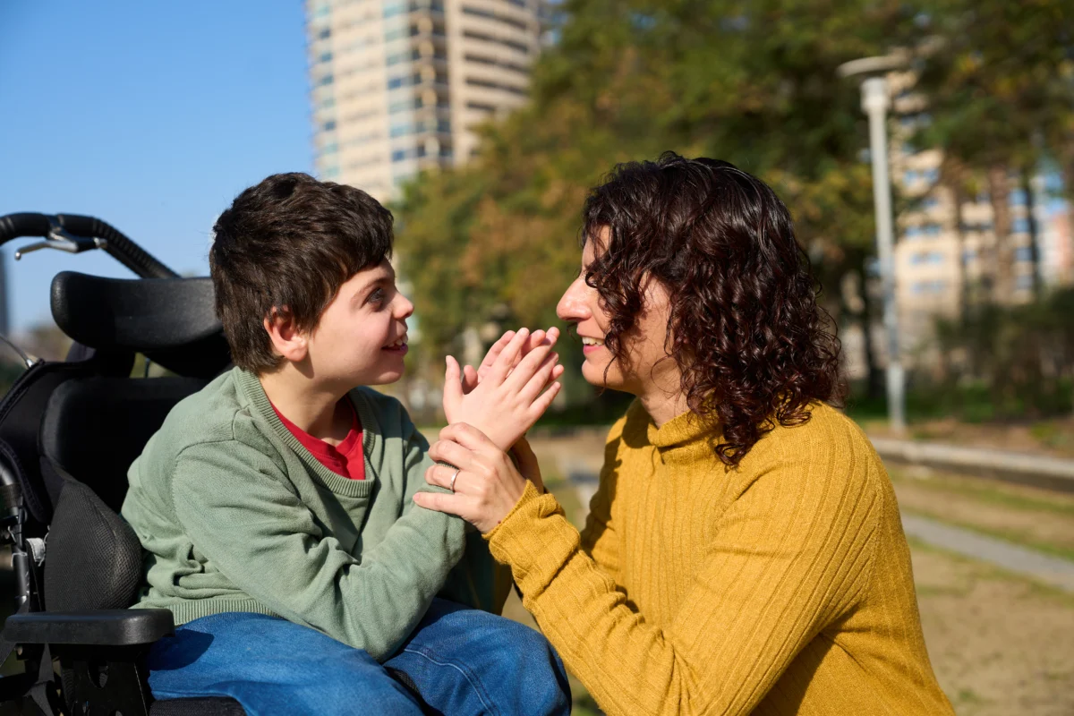 Woman working with boy with dissabilities - Branchability - Inclusive Workshops and Training